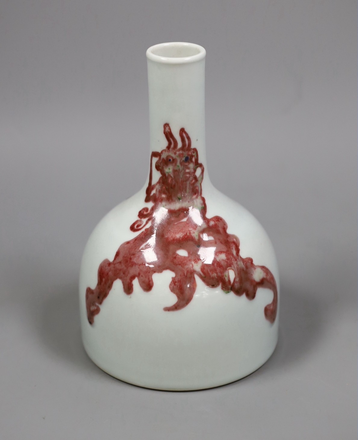 A Chinese underglaze copper red ’dragon’ bottle vase, 18cm tall